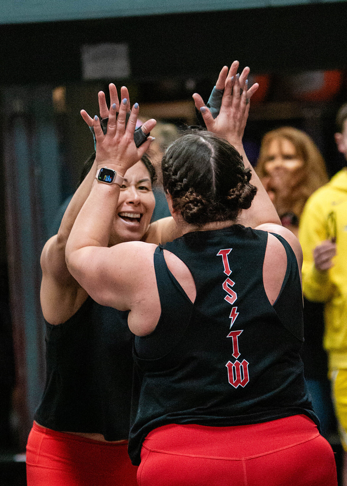 Members high-fiving after a workout at Catoctin Fitness
